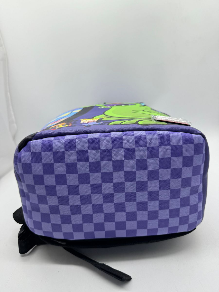 Close-up of the PVC material used in the Sprayground Reptar Chase Backpack, emphasizing its quality and textured surface