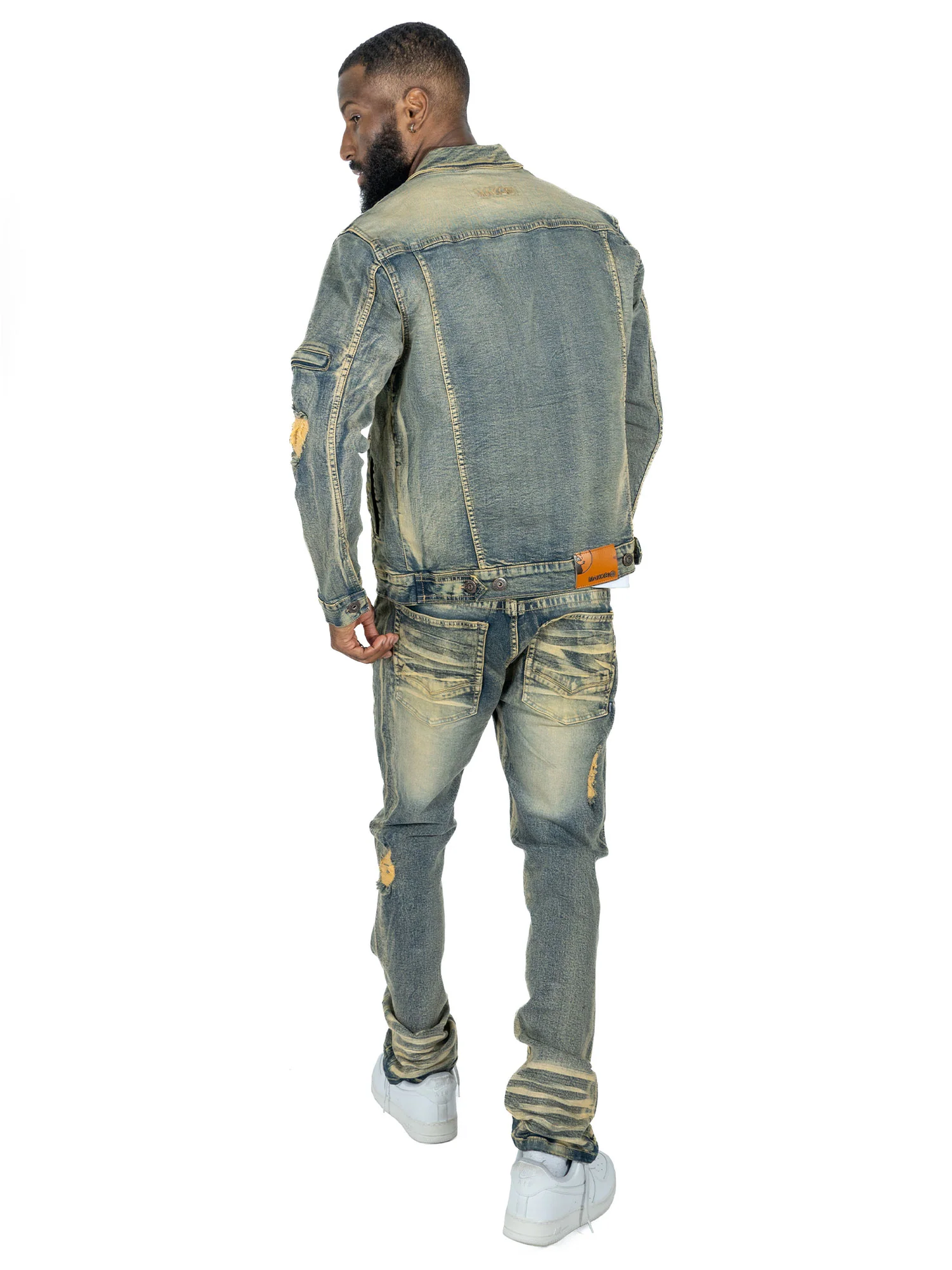 Back view of Makobi Moreli Dirt Denim Jeans displaying logo patch and reinforced seams