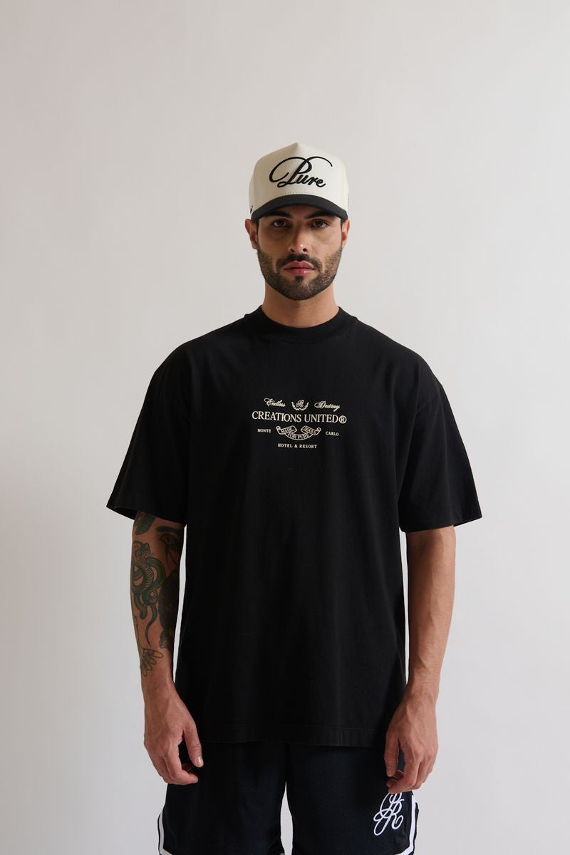 Pure Monclair Black Tee front view showcasing oversized fit and 100% cotton fabric