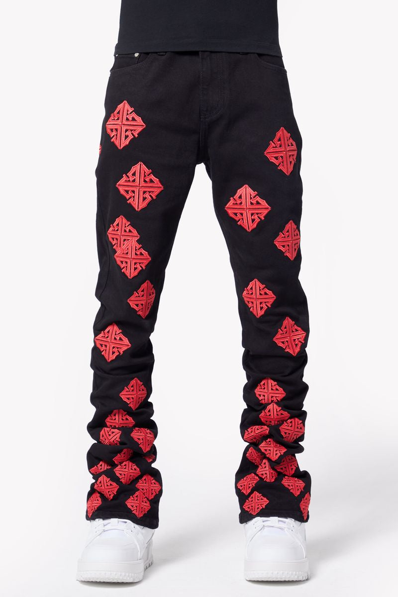 Close-up image of Guapi Crimson Icon Denim Jeans with distressed details and frayed hem