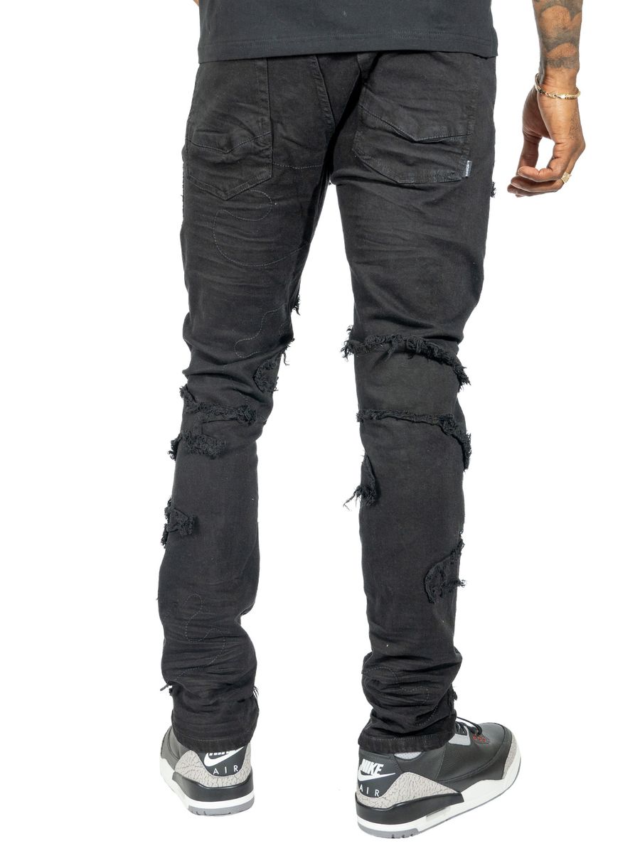 Fashionable black jeans featuring a unique design and premium materials