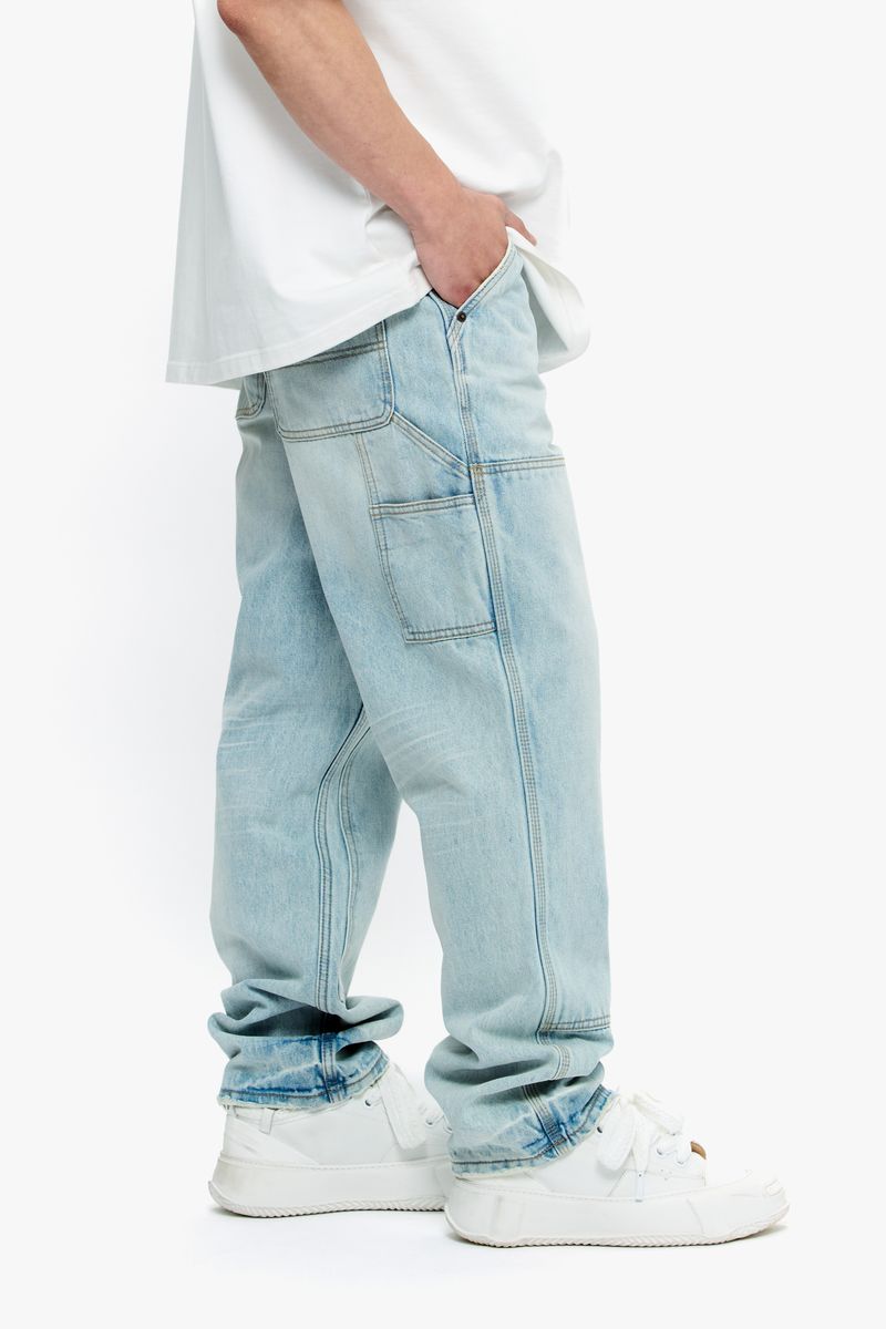 Detail shot of light blue wash denim fabric used in Valabasas Mr Straight jeans showing texture and color