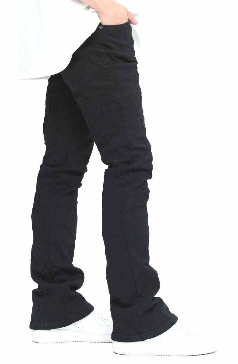 Valabasas Tire Jet Black Stacked Denim Jeans on model with white sneakers