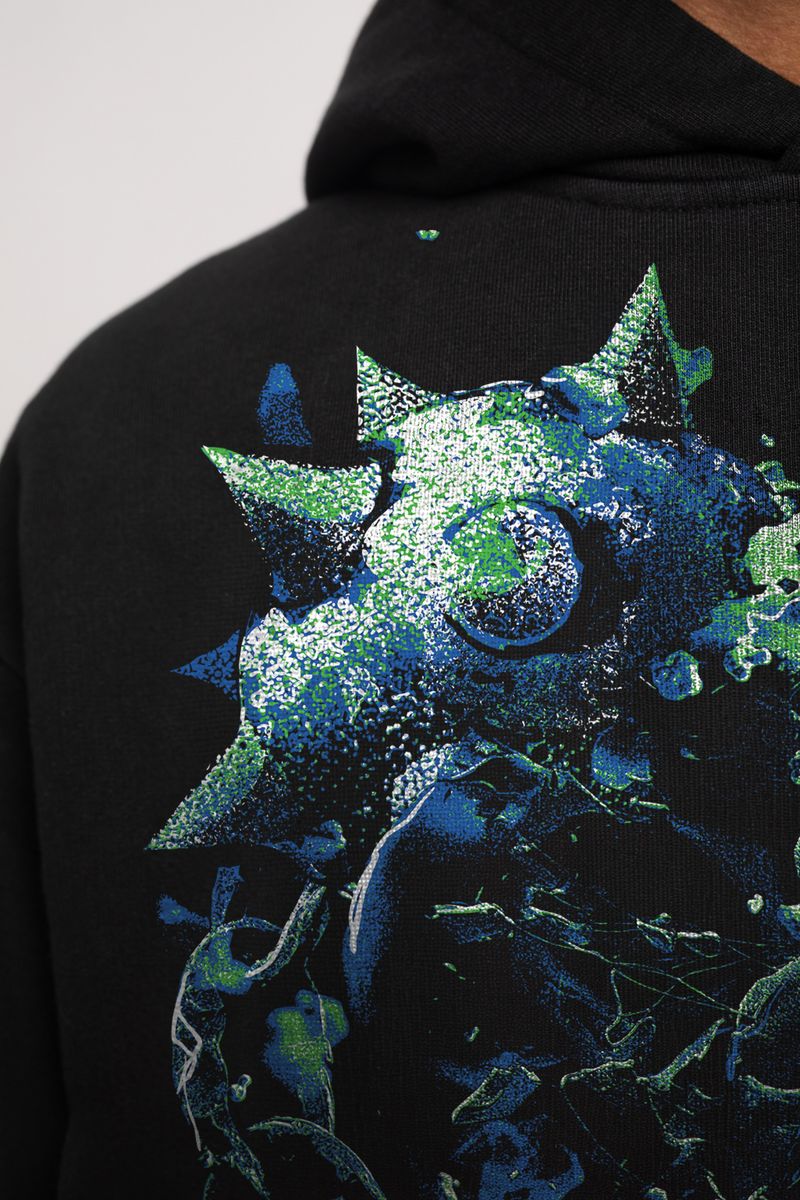 Side view of the Guapi Skull Cracker Hoodie with skull print