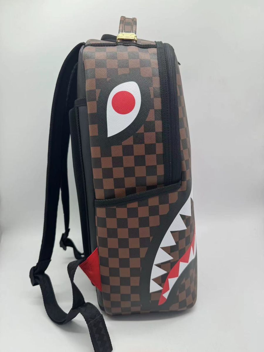 Front view of the Sprayground Split Sip Pink Check Backpack highlighting its 18-inch height and stylish design