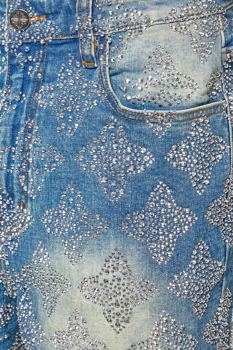 Back view of embellished denim shorts showcasing the intricate geometric patterns and high-quality denim