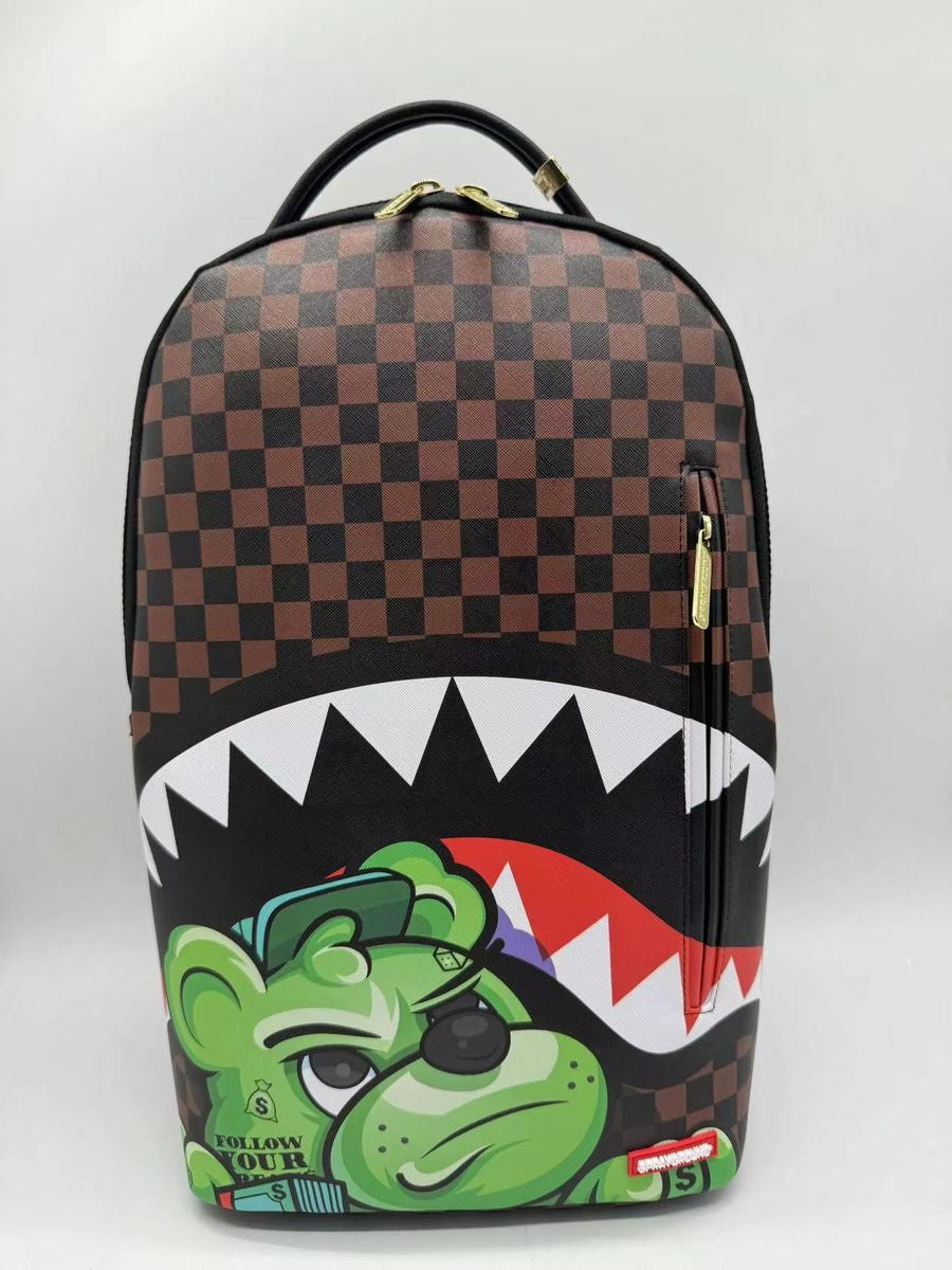 Front view of the Sprayground Money Grump DLXSV Backpack highlighting its 18-inch height, 115-inch width, and 65-inch depth constructed from durable 100% PVC material