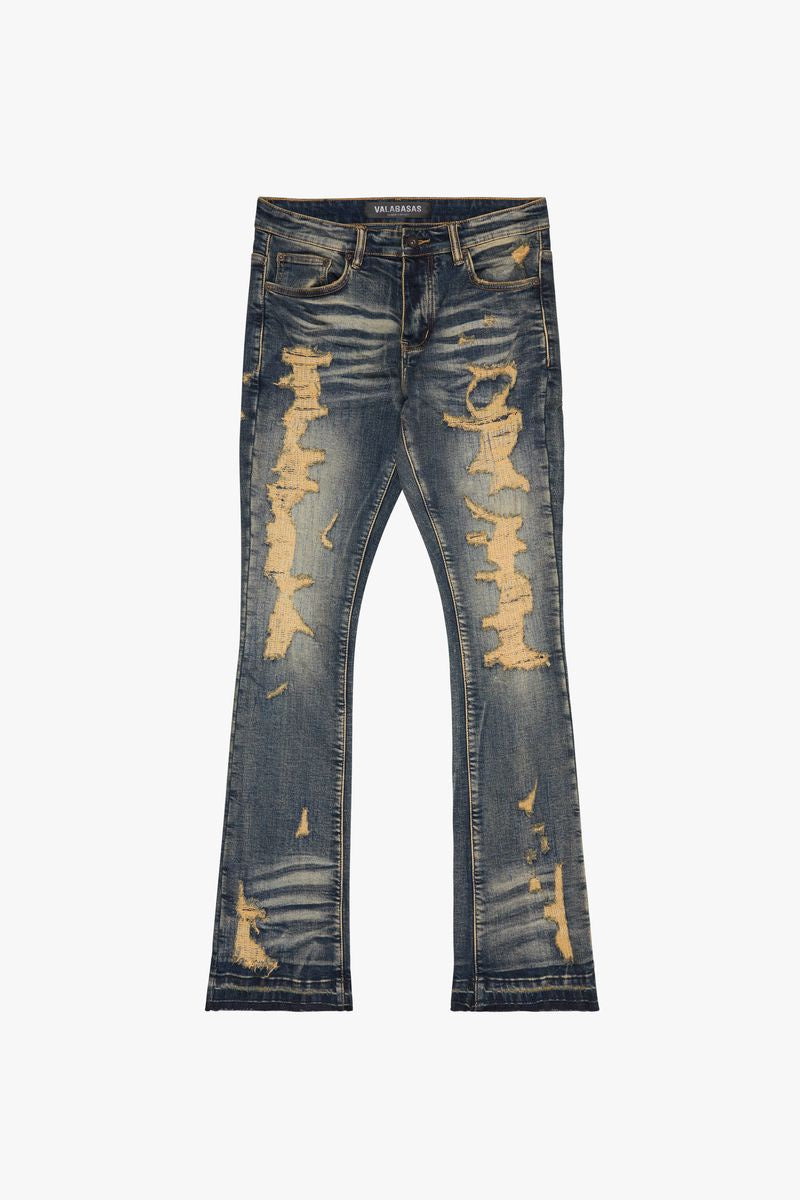 Dark vintage wash stacked denim jeans featuring tearaway design and rugged style