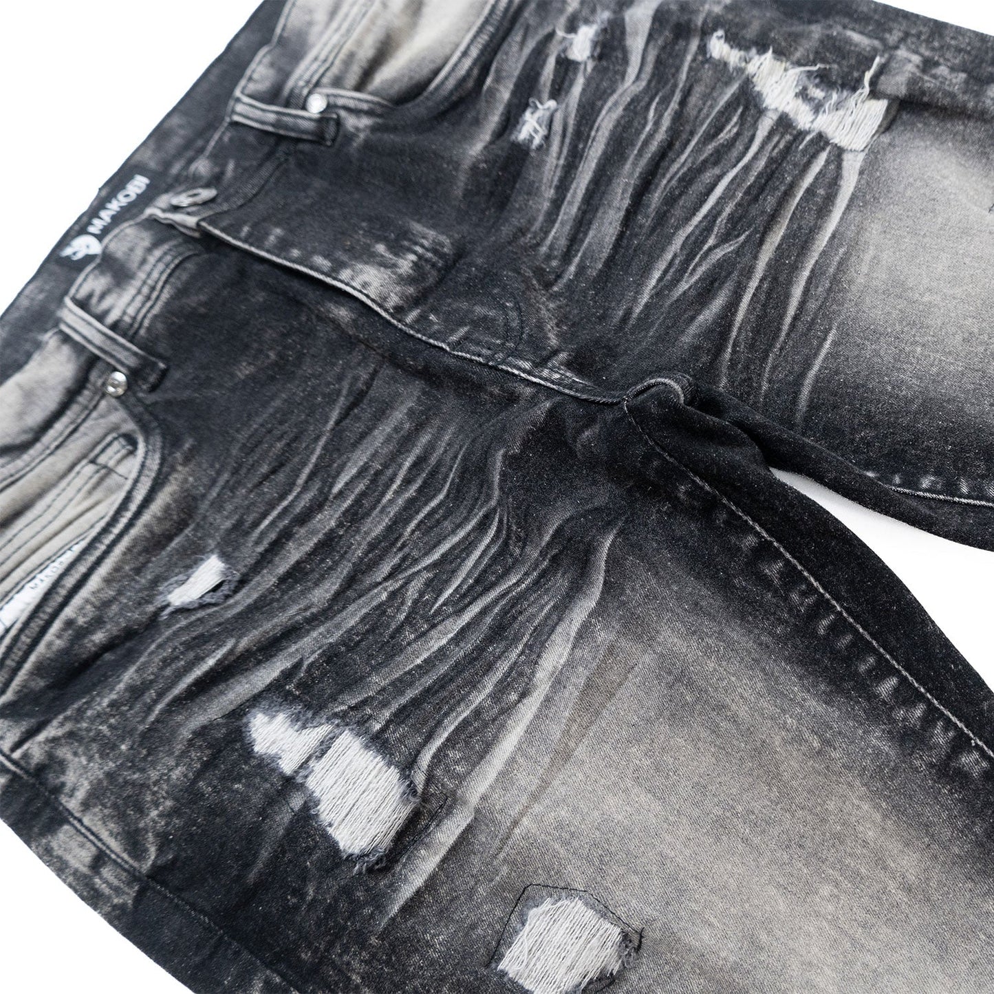 Side view of Makobi Moreli Black Wash Denim Jeans demonstrating original design and trendy appeal
