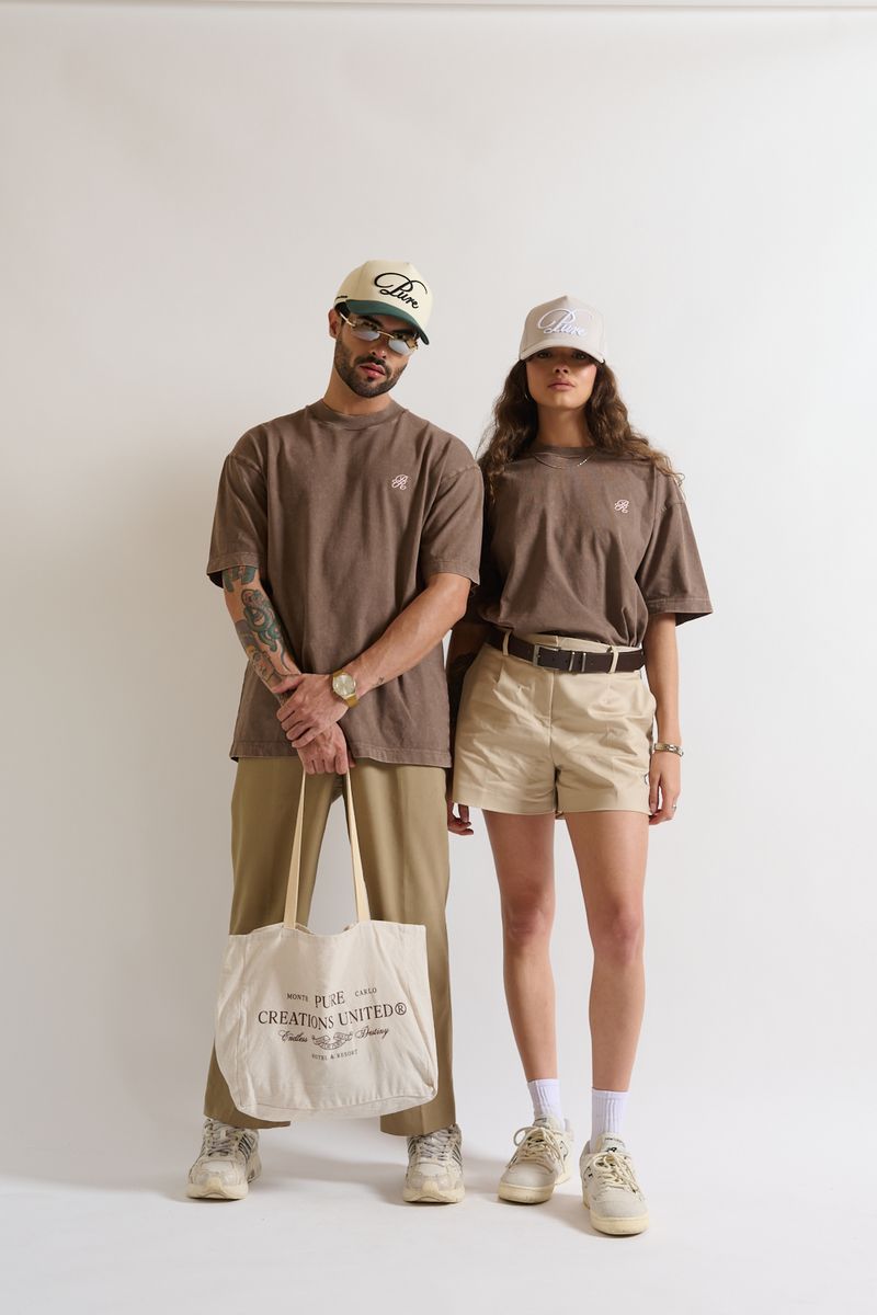 Styled on a model, PURE Monclair Brown Tee demonstrating versatile oversized urban style