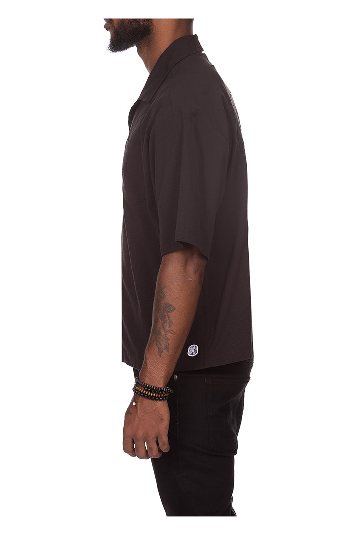 BBC Black BB Cabana SS Woven Button Up folded on display shelf
