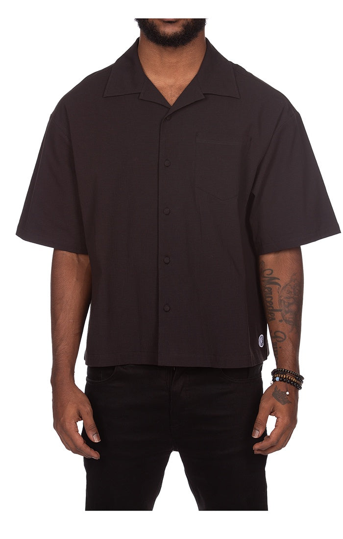 BBC Black BB Cabana SS Woven Button Up on hanger in closet