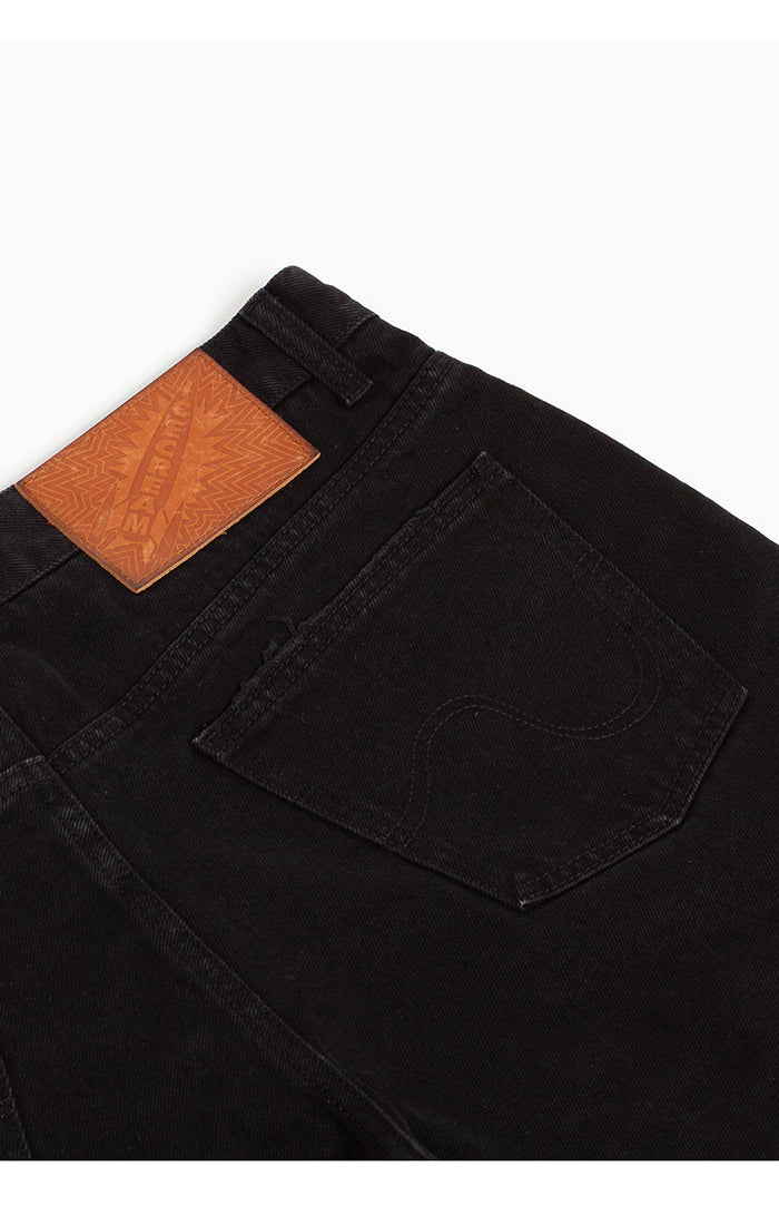 Close-up of Ice Cream Black Dog Black Caramel Jean Shorts showcasing the detailed strawberry fit and black caramel color