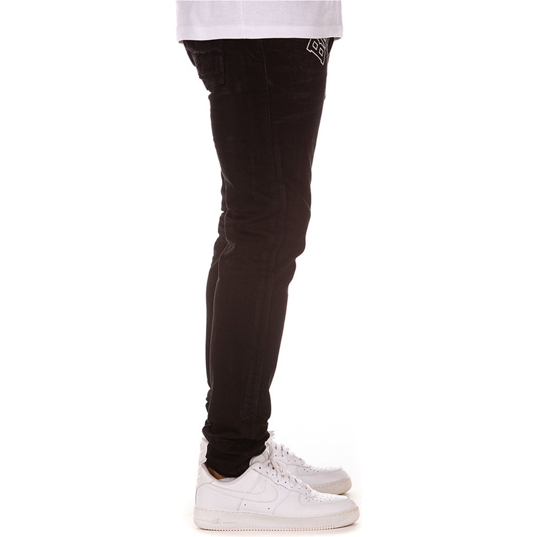 Back view of a person wearing BBC Black Vader BB Tech Jeans, showcasing the sleek and modern design