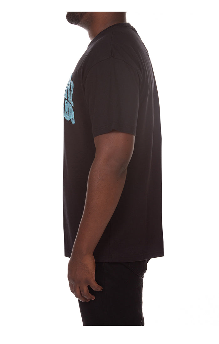 BBC Black BB Arch SS Knit (841-2314) sweater styled with a leather jacket and sneakers for a modern streetwear vibe