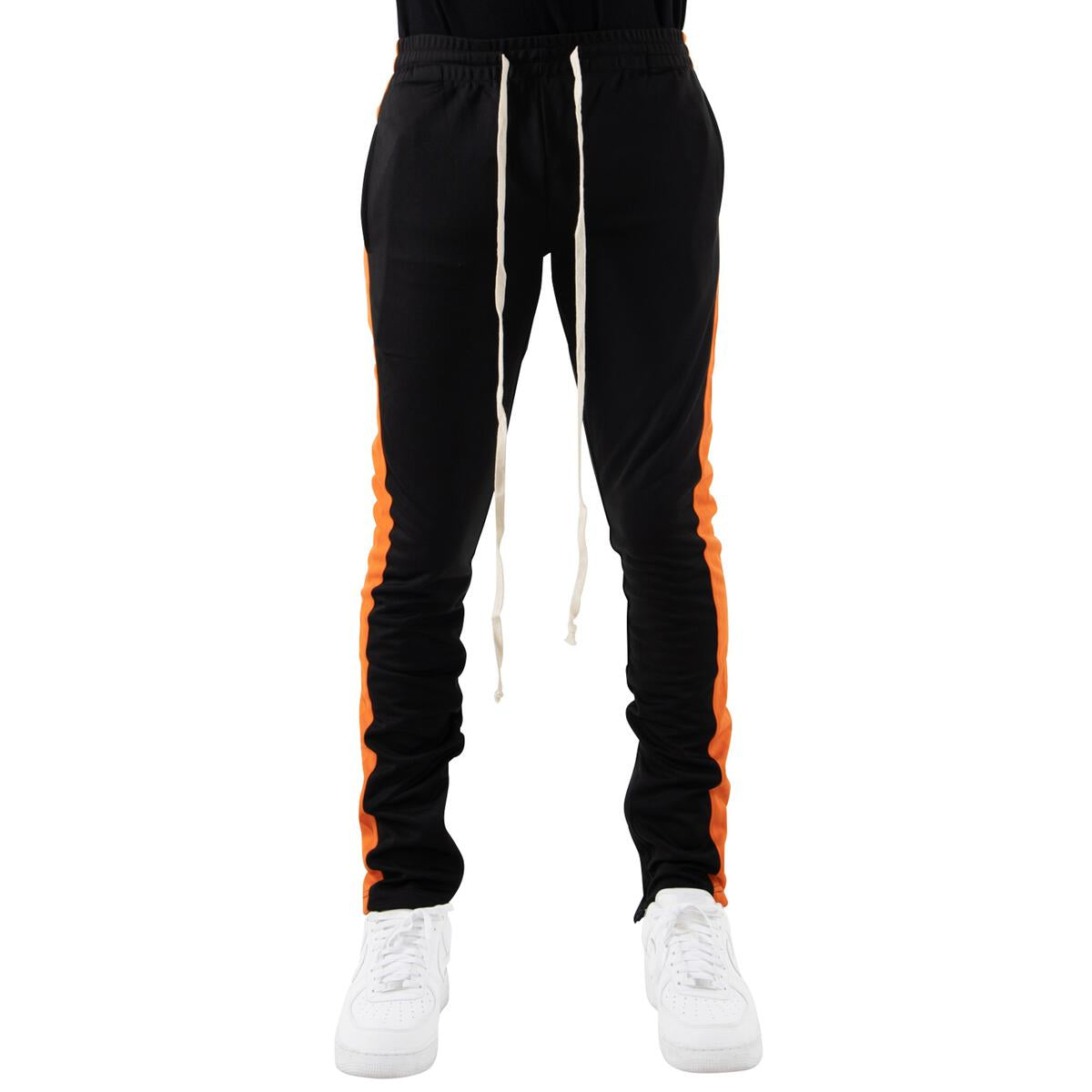 Close-up of EPTM Black Track Pants with Orange Stripe and Zipper Detail