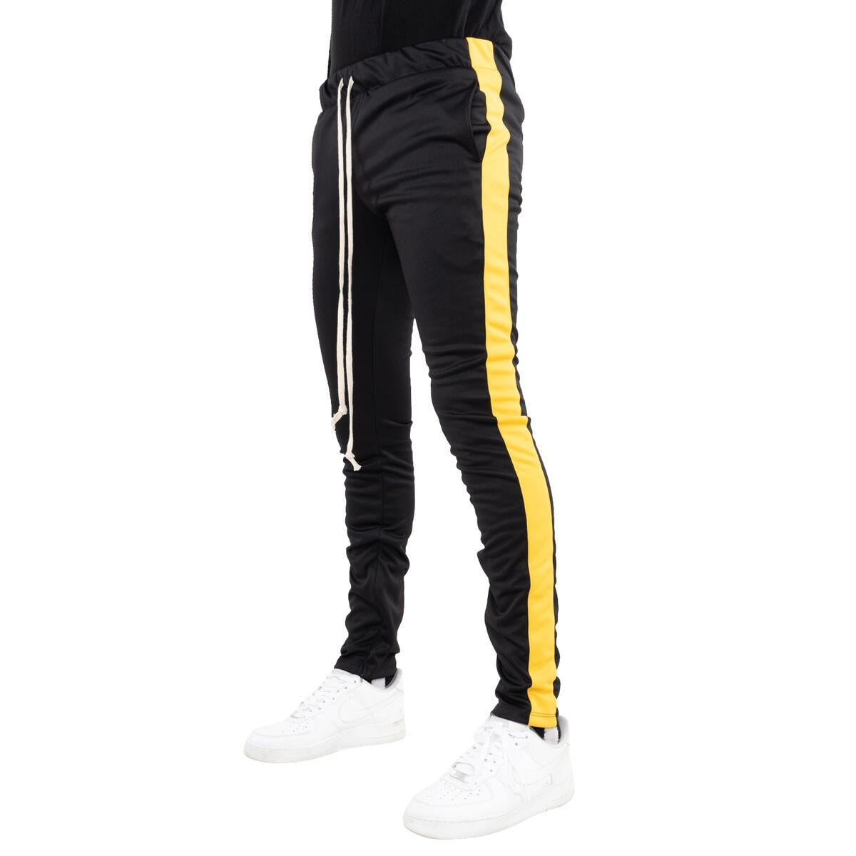 Close-up of the yellow side stripe on EPTM Black Track Pants (EP7908)