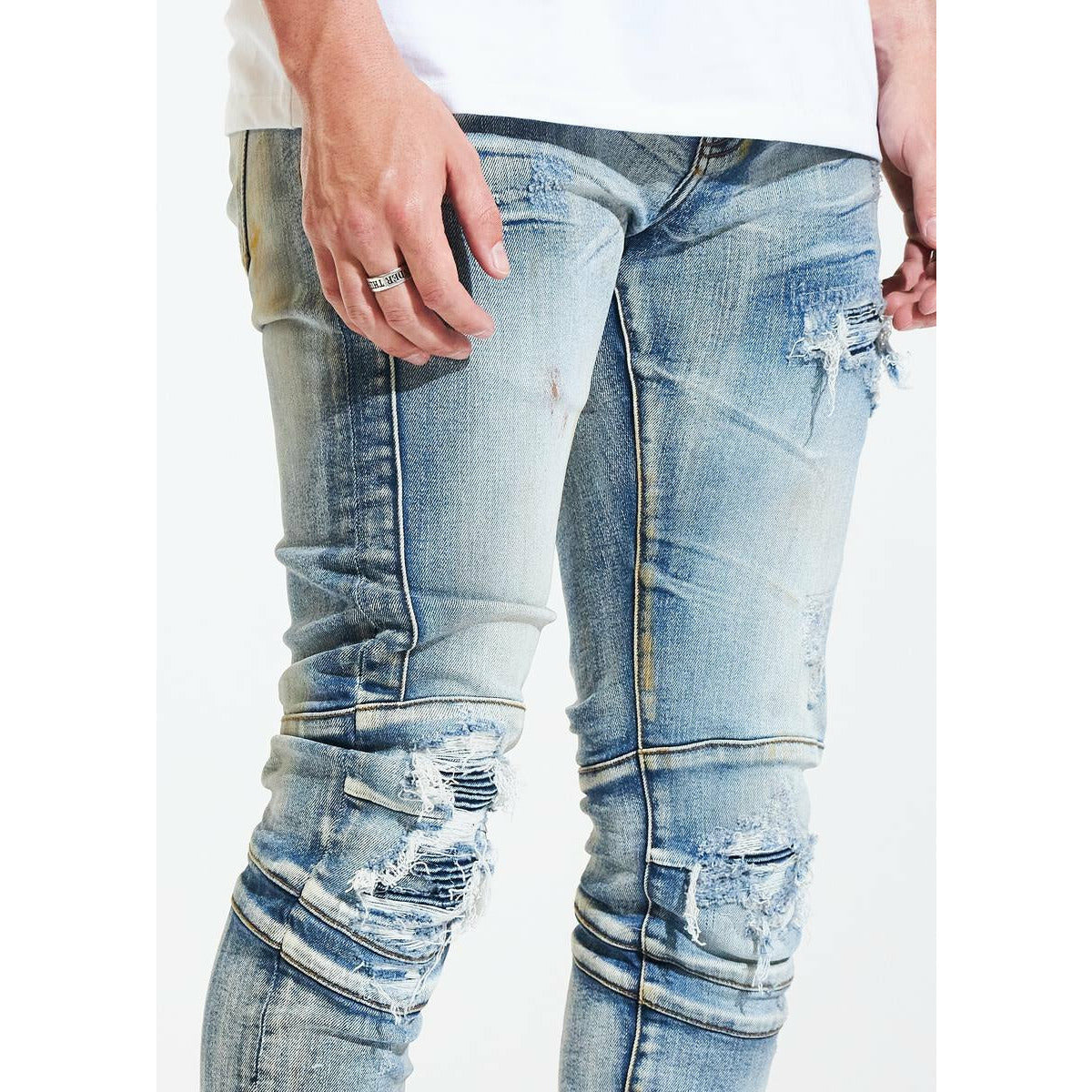 High-quality denim material with stylish tears and biker details