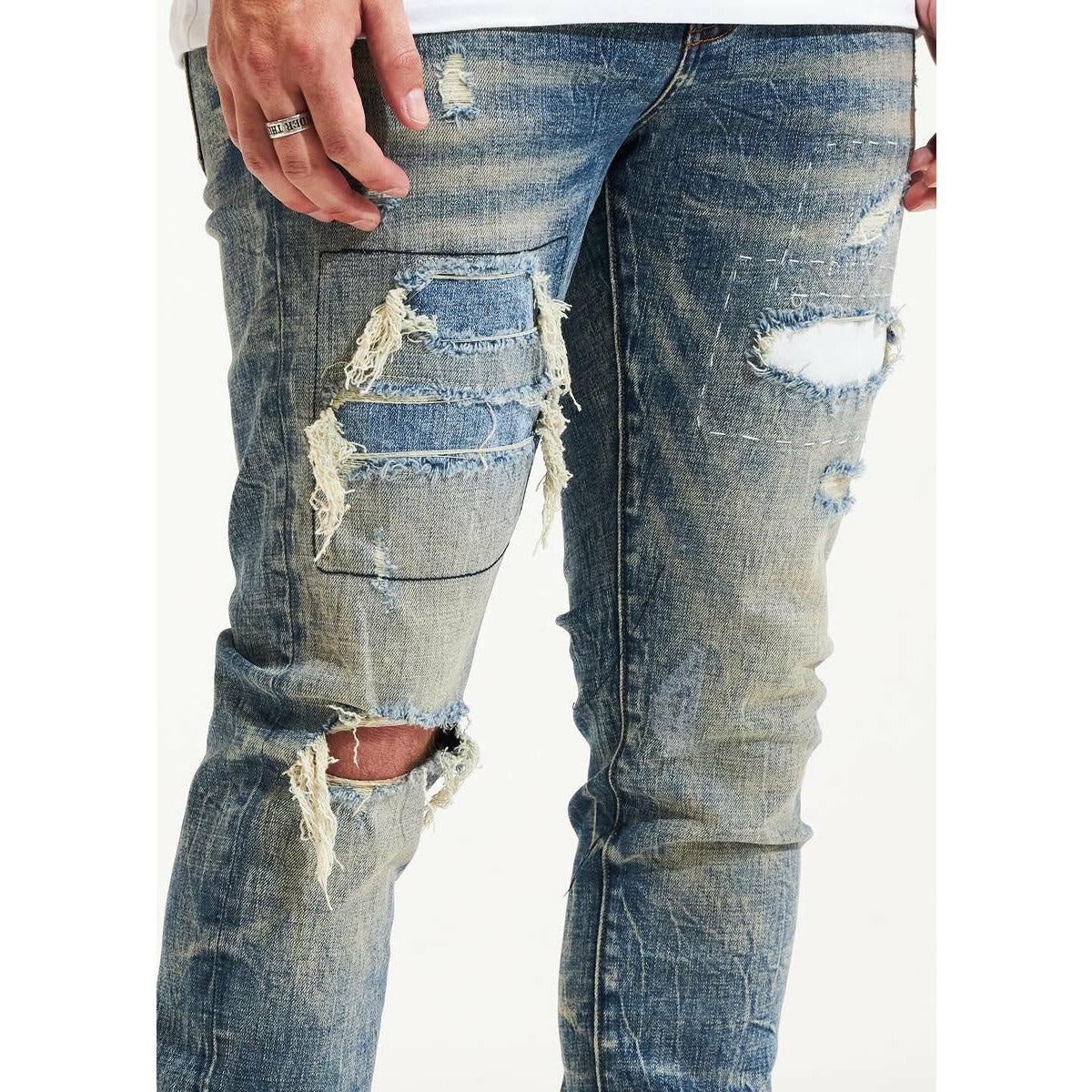 Embellish Blue Zane Denim Jeans in a street style outfit with hoodie and cap