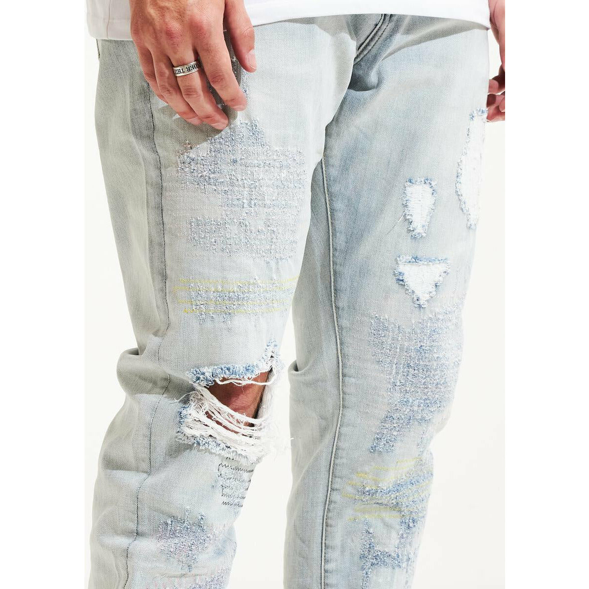 Stylish and comfortable light blue denim with intricate distressing details