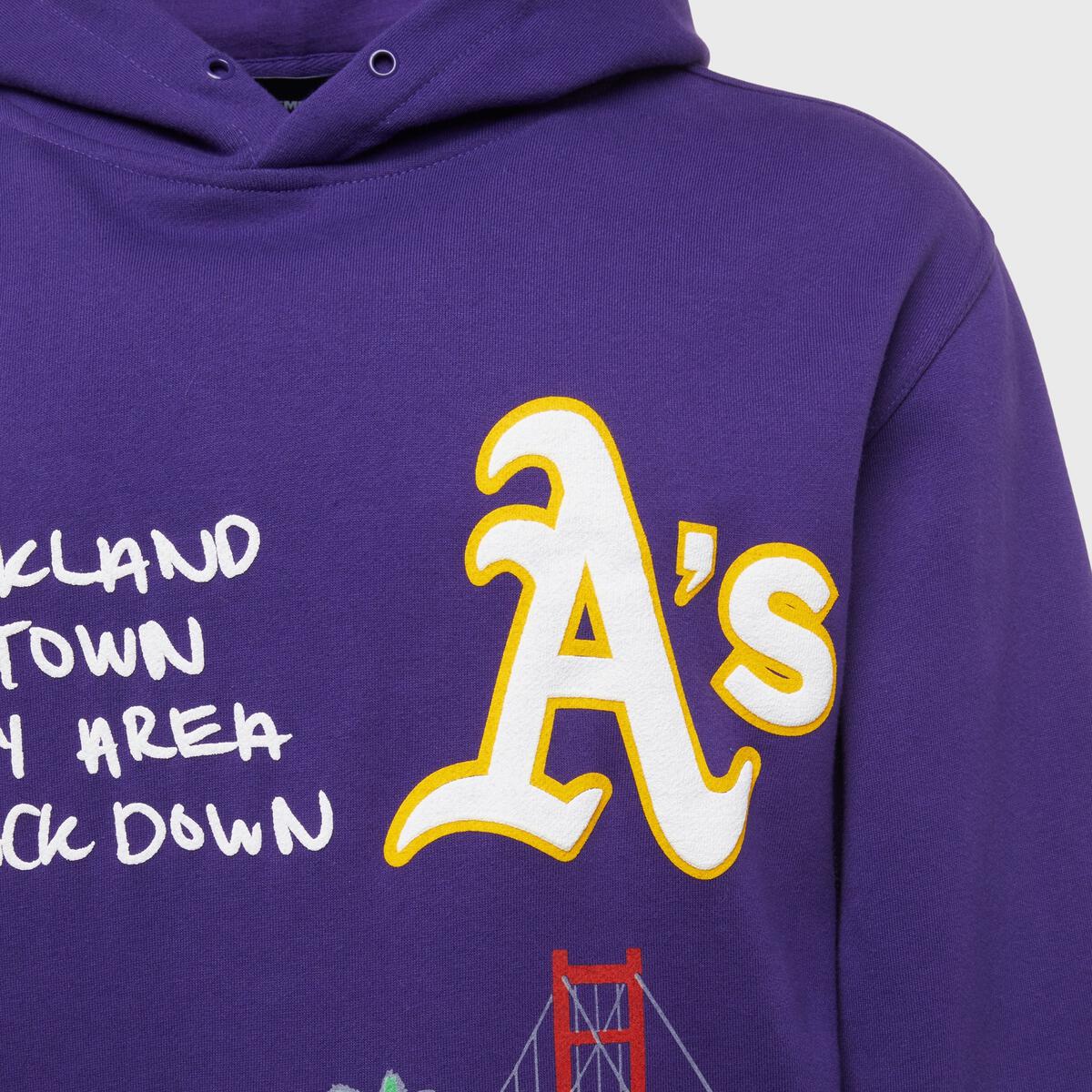 Purple hoodie with Homme + Femme branding on the sleeve