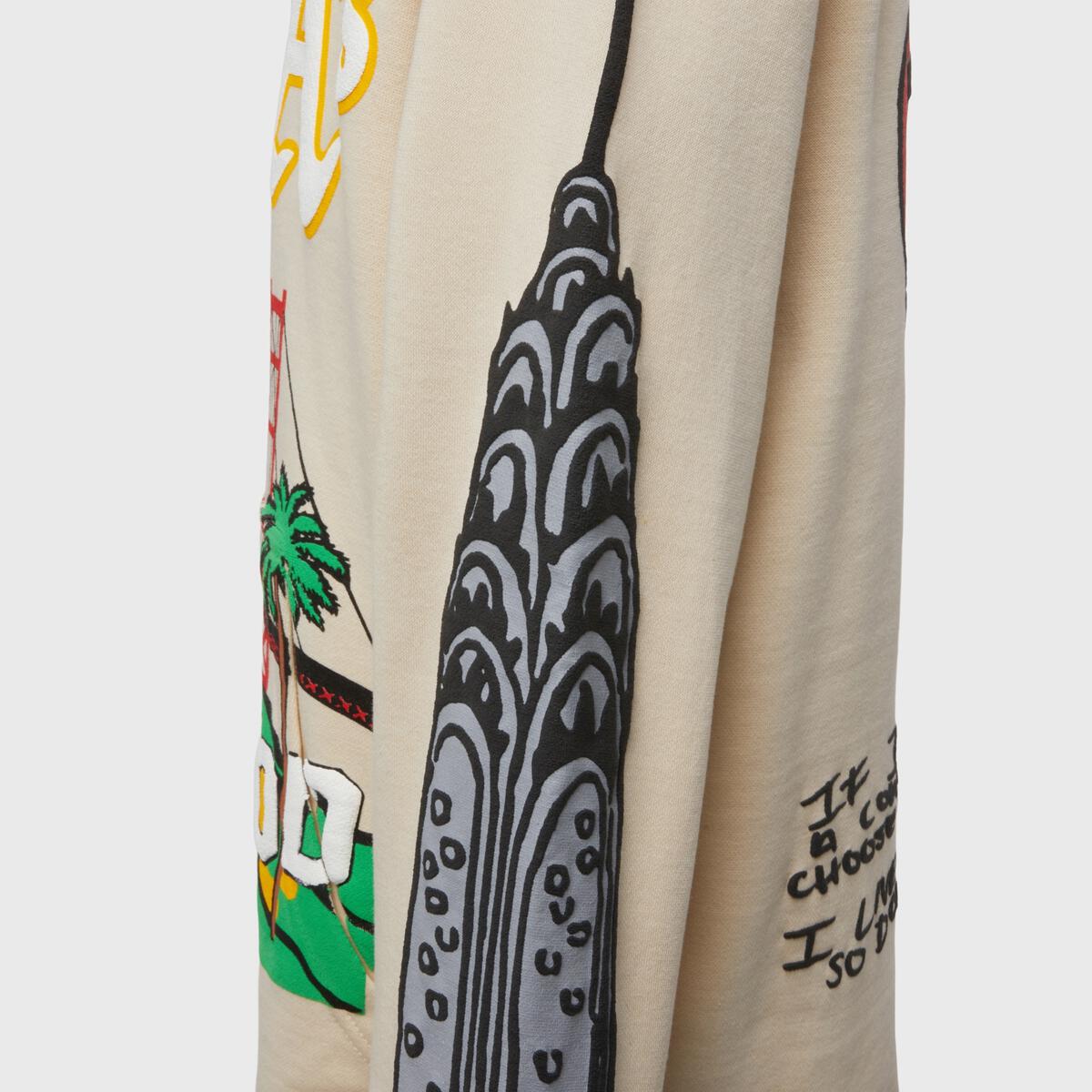 Back view of the Homme + Femme Cali to NYC HOODIE- Tan (HFFW202040) with large graphic print