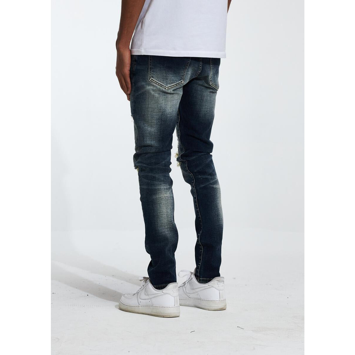 Crysp Denim Atlantic Indigo Jeans paired with white sneakers and a casual top