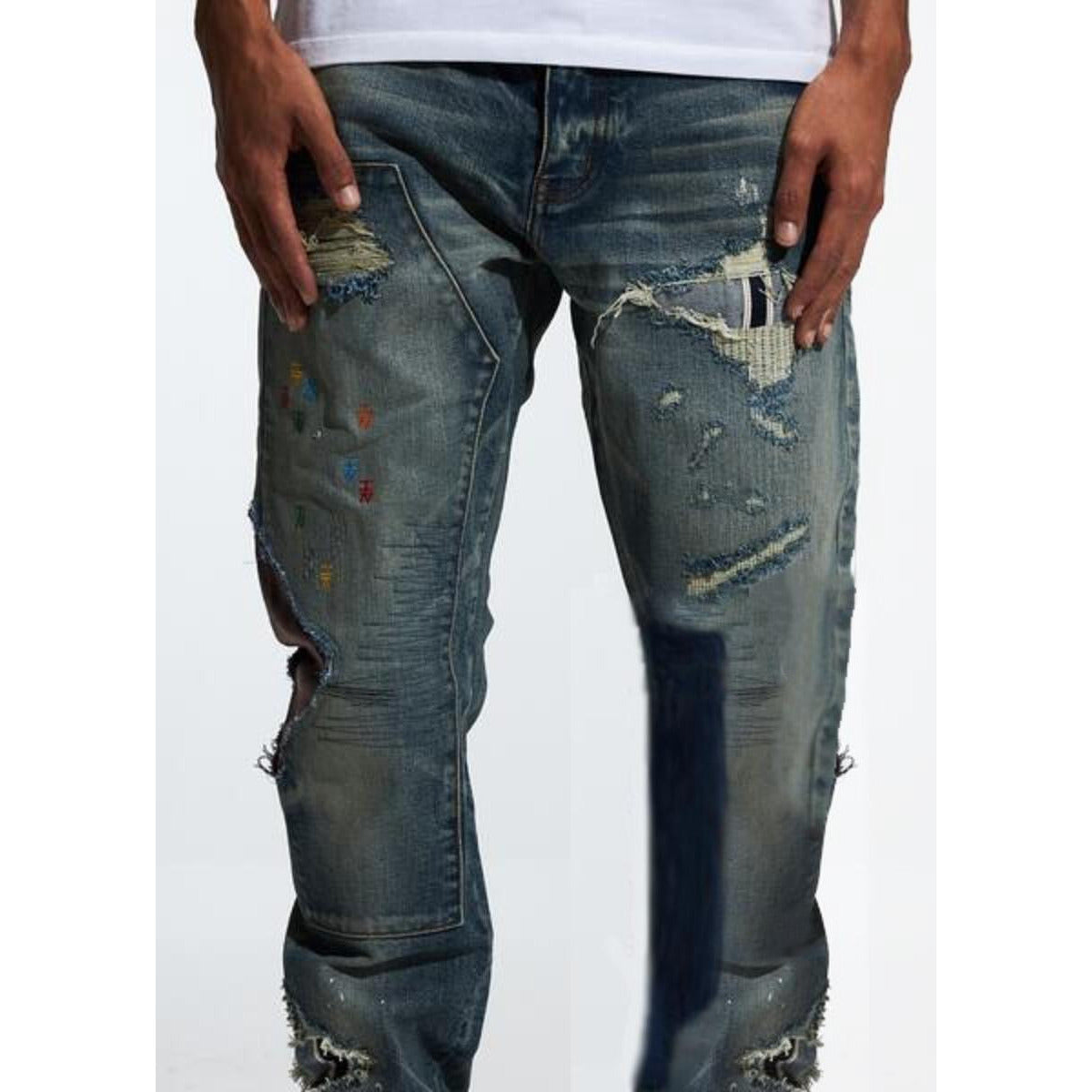 Close-up of the front view of Embellish Campberg Ripped Denim Jeans (EMBF222-6) showing the ripped design
