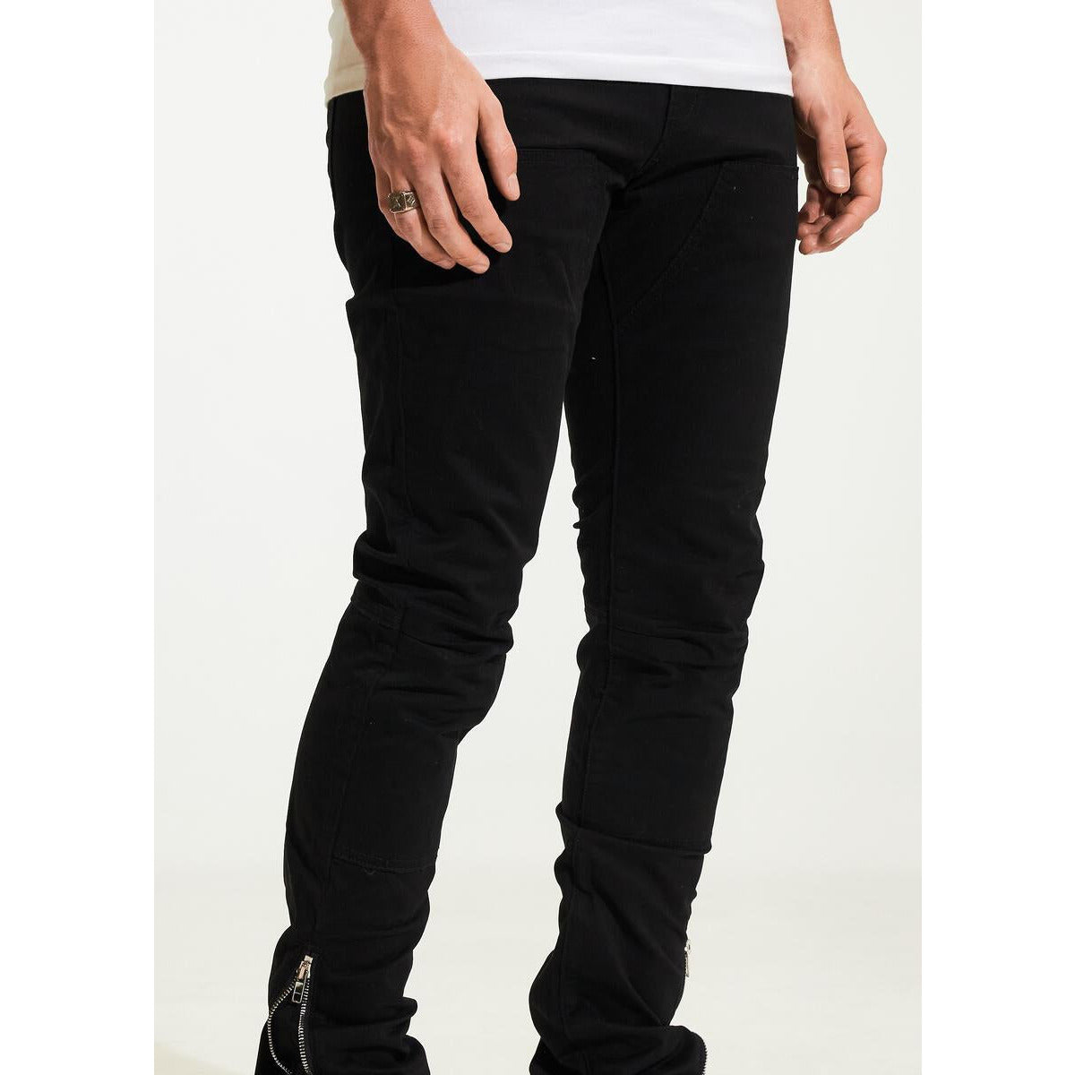 Black ripped jeans with a relaxed fit and distressed detailing