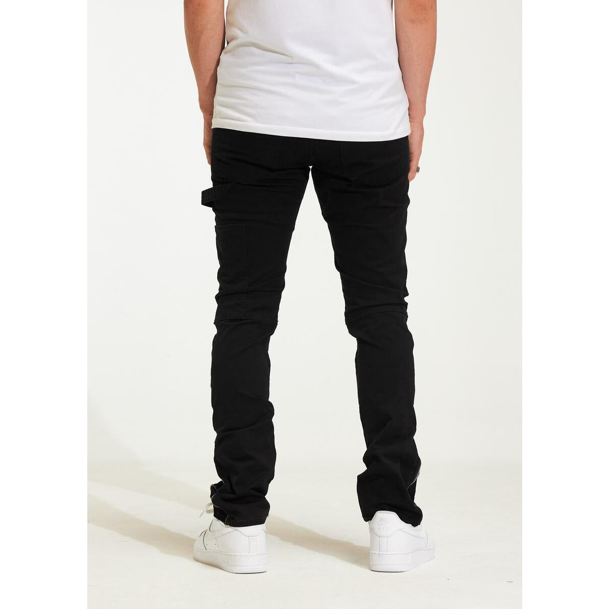 Close-up of Crysp Denim Smith Pant Black Ripped Jeans (CRYH22-205) pocket with silver hardware and frayed hem, on white background