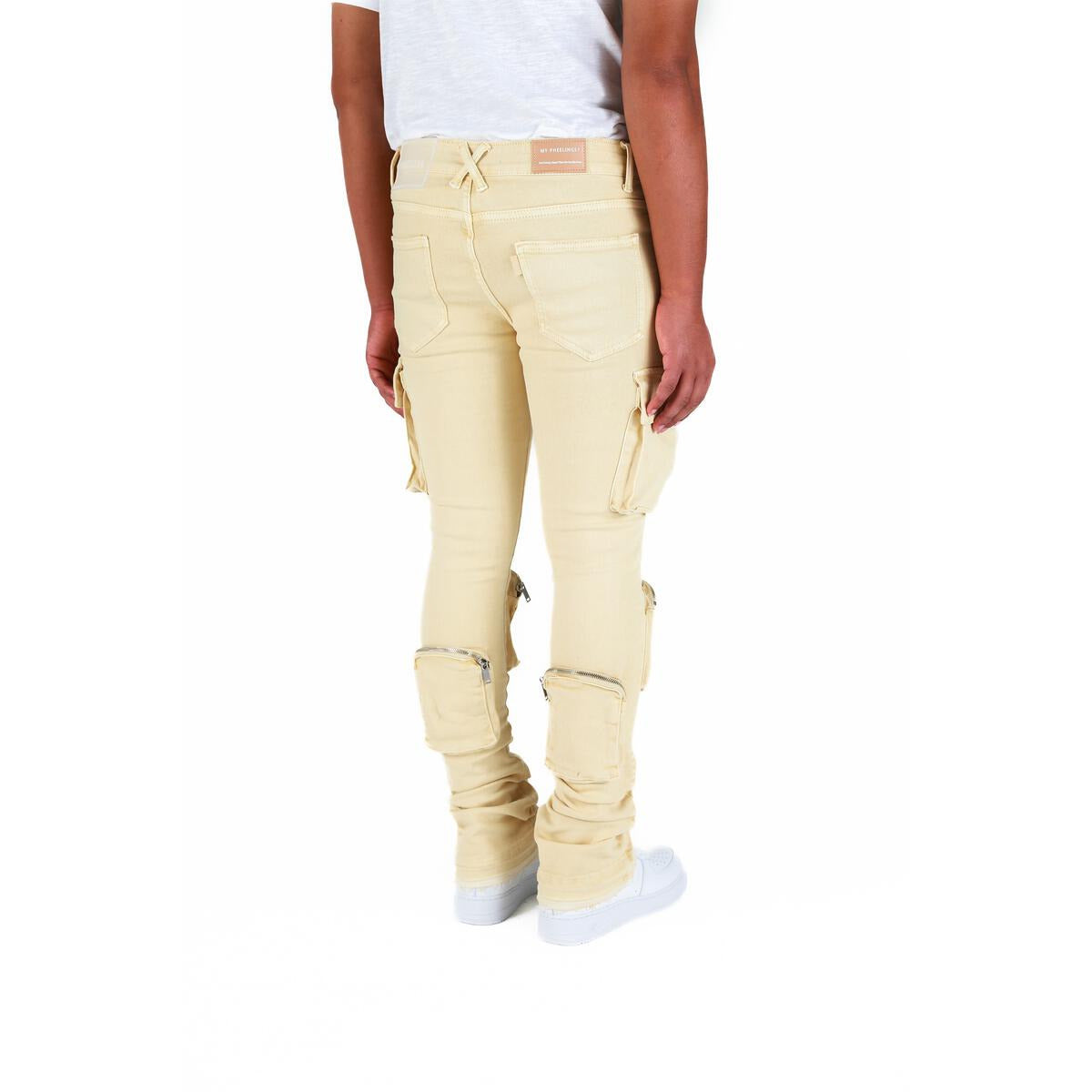 High-waisted cream cargo denim flares by PHEELINGS with stacked design