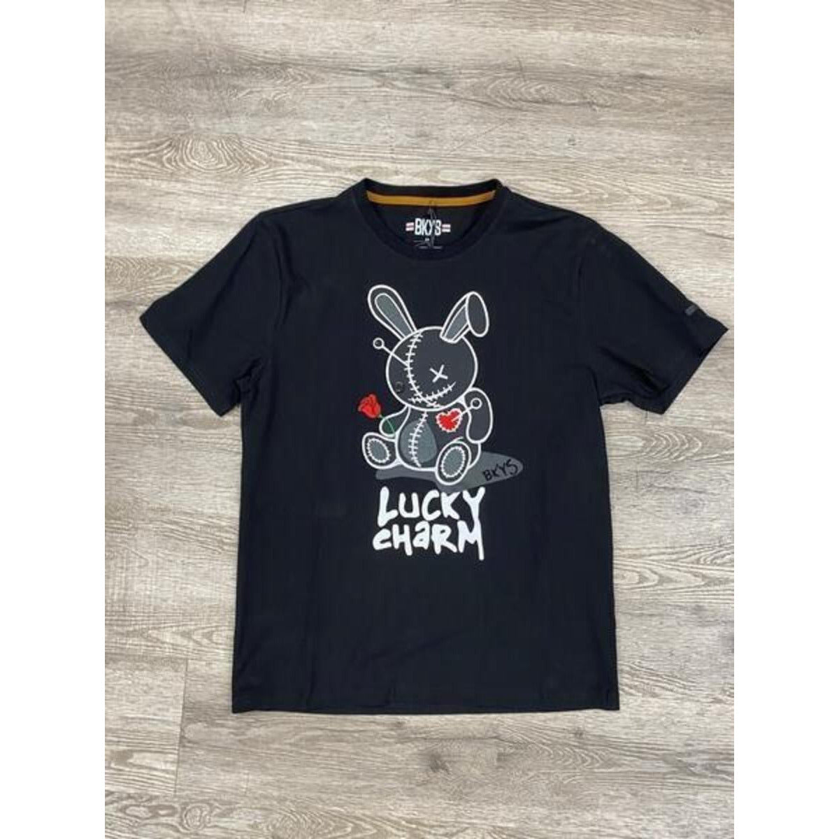 Black Keys Lucky Charm black tee with white patch, a stylish and versatile wardrobe staple for casual and streetwear looks