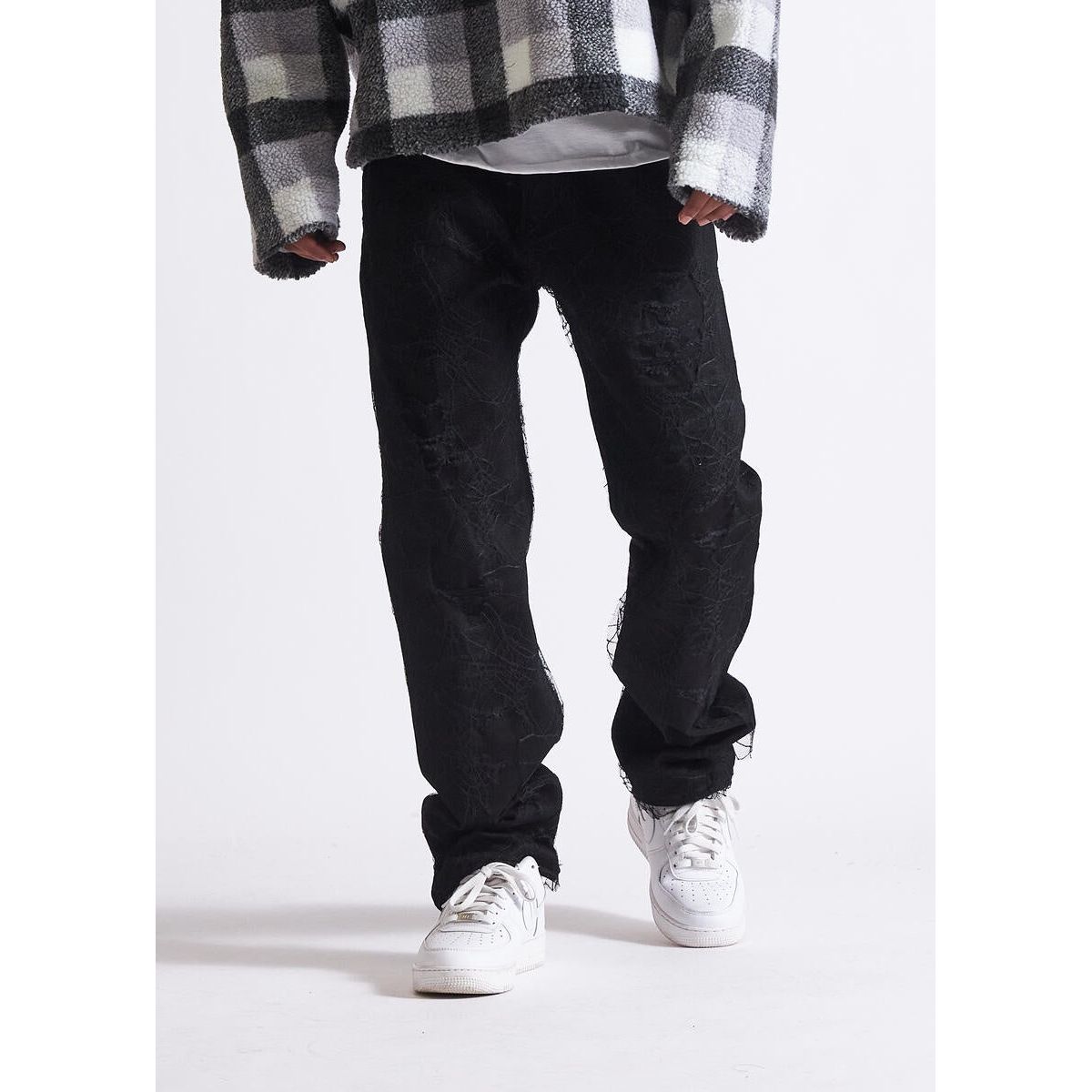 Embellish Parker Black Ripped Denim Jeans with distressed detailing and frayed hem