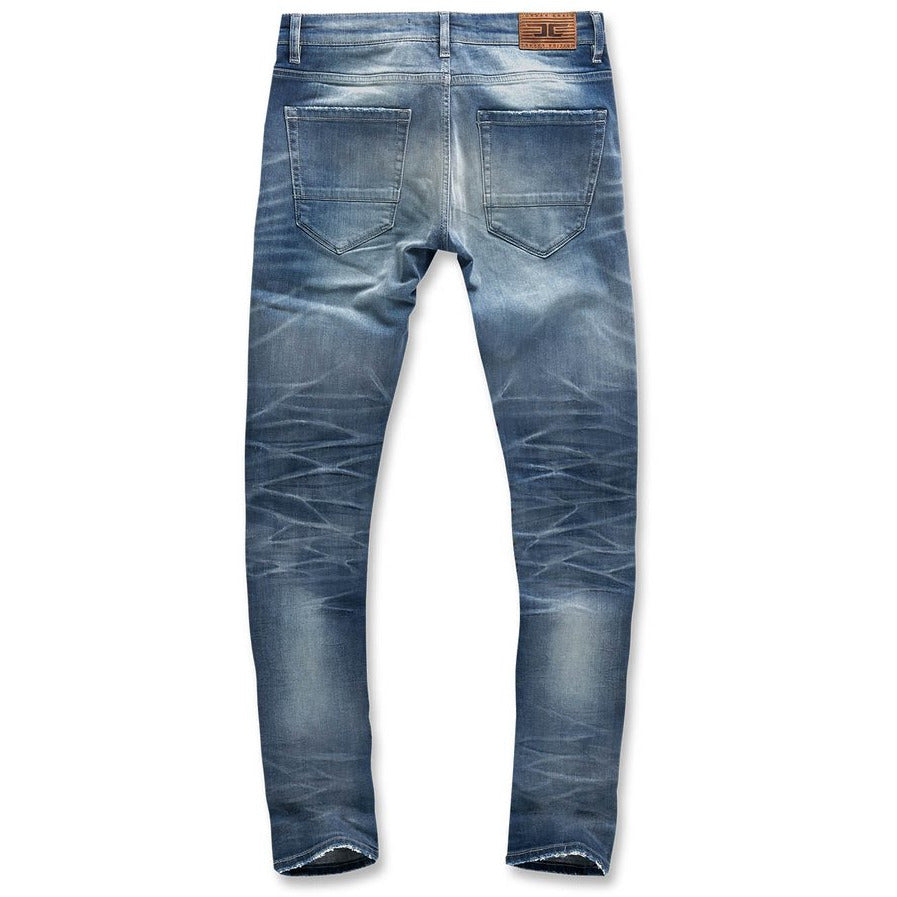 Side view of Jordan Craig Aged Wash Fused Shredded Denim Jeans (JM3373) showcasing the slim fit and modern style