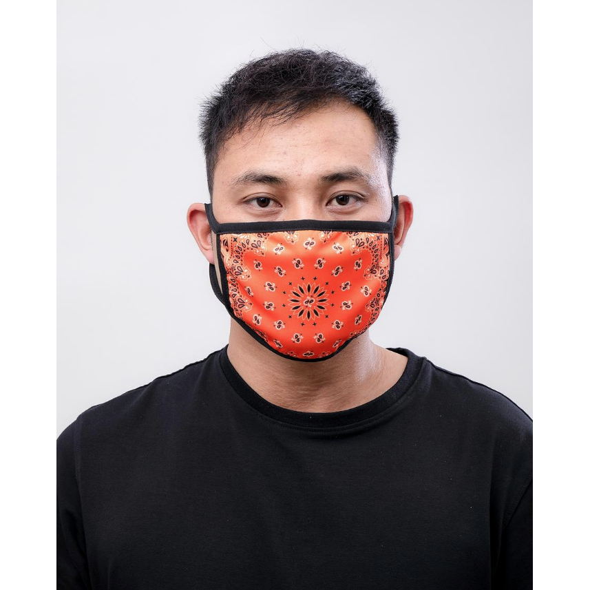 Close-up of Hudson Solid Paisley Face Mask in Orange, a stylish and comfortable protective accessory for daily wear