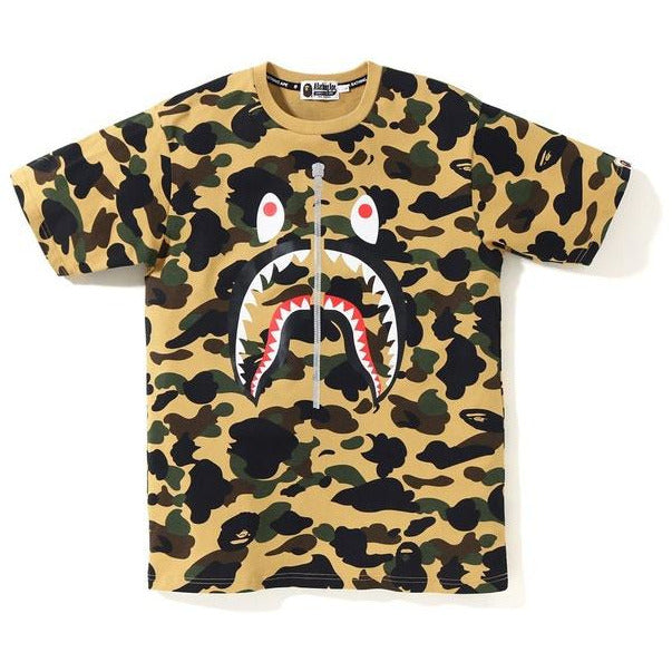 BAPE 1st Camo WGM Shark Tee in vibrant yellow color, featuring iconic shark design and bold WGM logo on the front