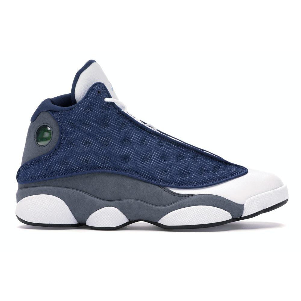 Close-up of the Jordan 13 Retro - Flint (2020) sneakers, featuring a mix of grey, white, and blue accents on the upper and a signature holographic logo on the heel