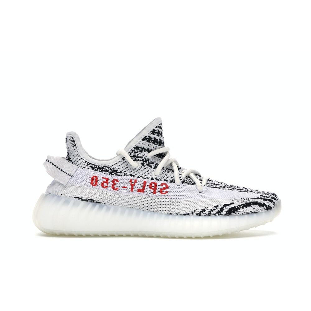 Close-up view of the adidas Yeezy Boost 350 V2 - Zebra sneakers, featuring black and white zebra print pattern, designed by Kanye West