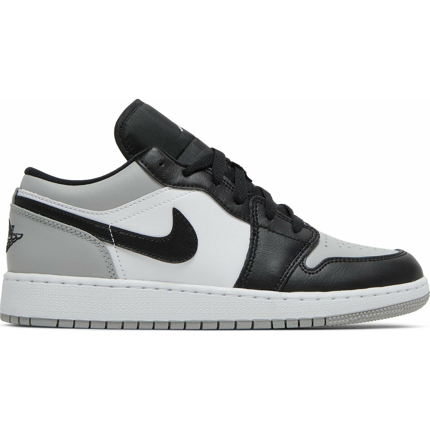 Close-up image of the Jordan 1 Low - Shadow Toe (GS) sneaker in black, white, and grey colorway, showcasing the iconic Air Jordan logo and classic low-top silhouette