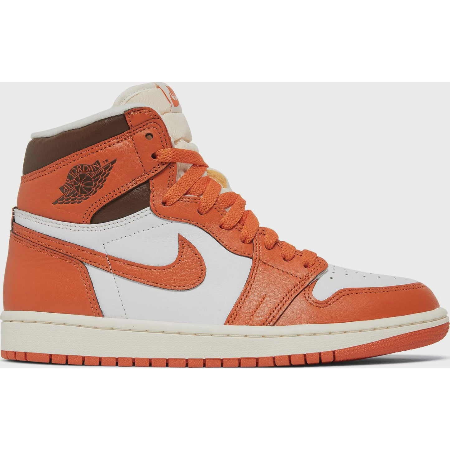 Close-up image of the Jordan 1 Retro High OG - Starfish (W) women's sneakers with white and orange colorway and iconic Nike Swoosh logo