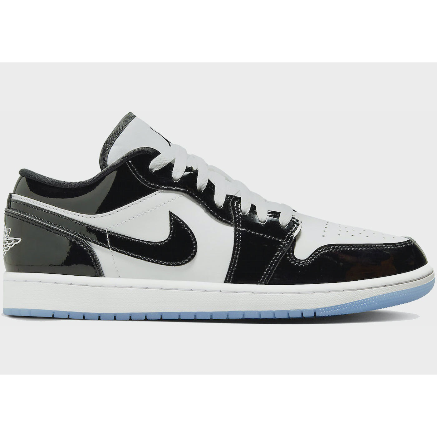 White and purple Jordan 1 Low SE Concord sneakers with black accents and Nike logo