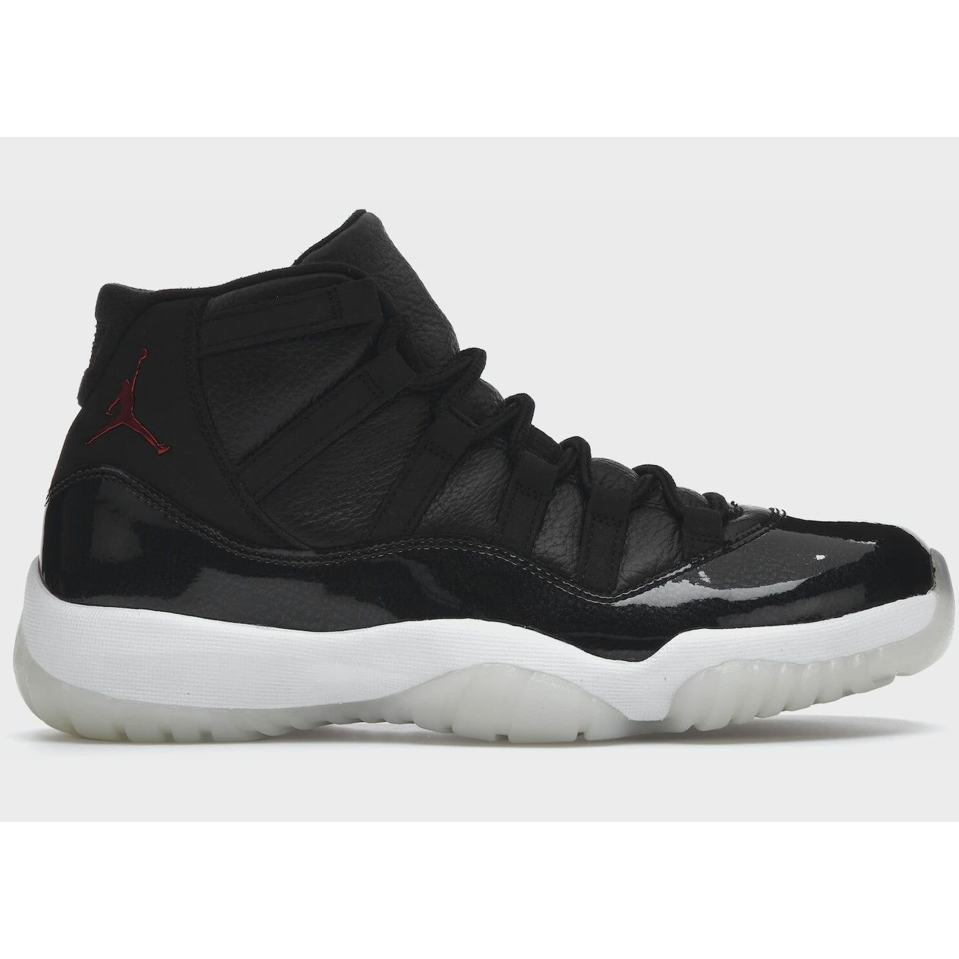 Black and red Jordan 11 Retro - 72-10 sneakers with patent leather, white midsole, and translucent outsole