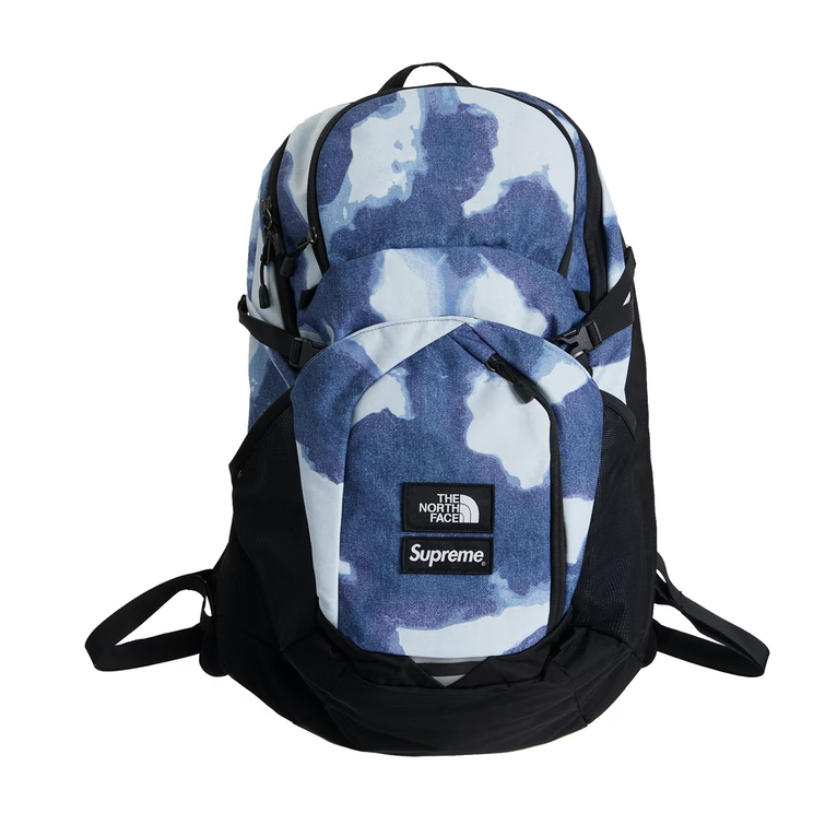 Supreme The North Face Bleached Denim Print Pocono Backpack -Indigo, a stylish and durable denim backpack with a unique bleached print design in indigo color