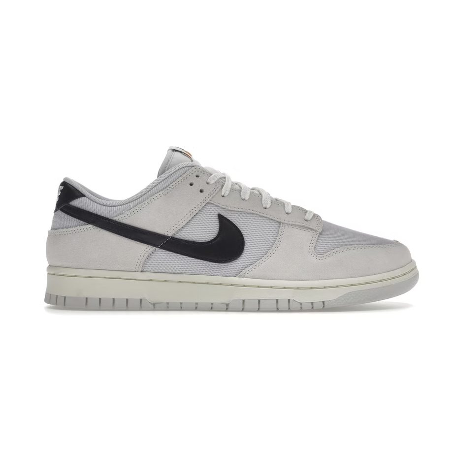 Nike Dunk Low - Certified Fresh black and white sneakers with iconic Nike swoosh logo