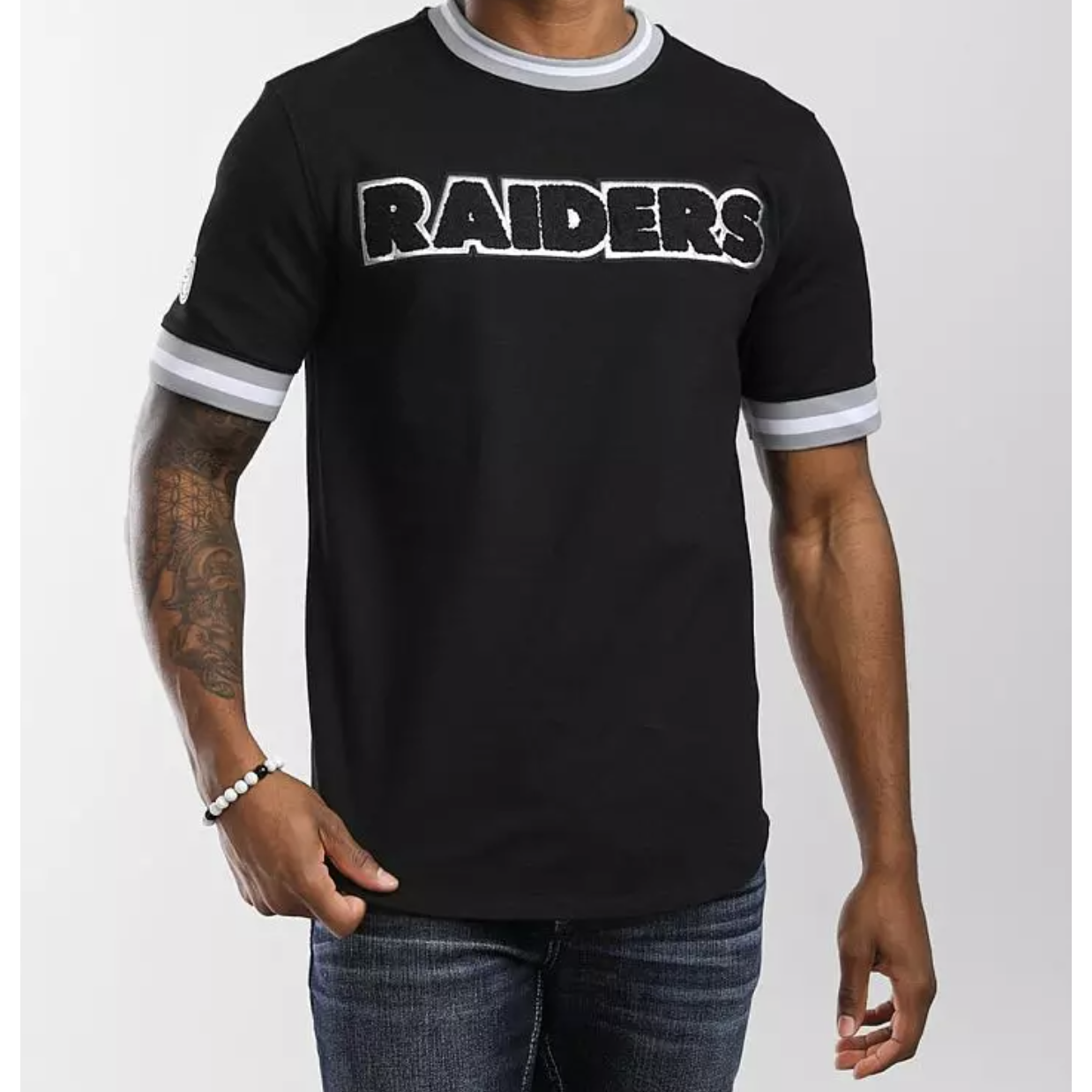 A black Las Vegas Raiders PRO TEAM SS Jersey by Pro Standard