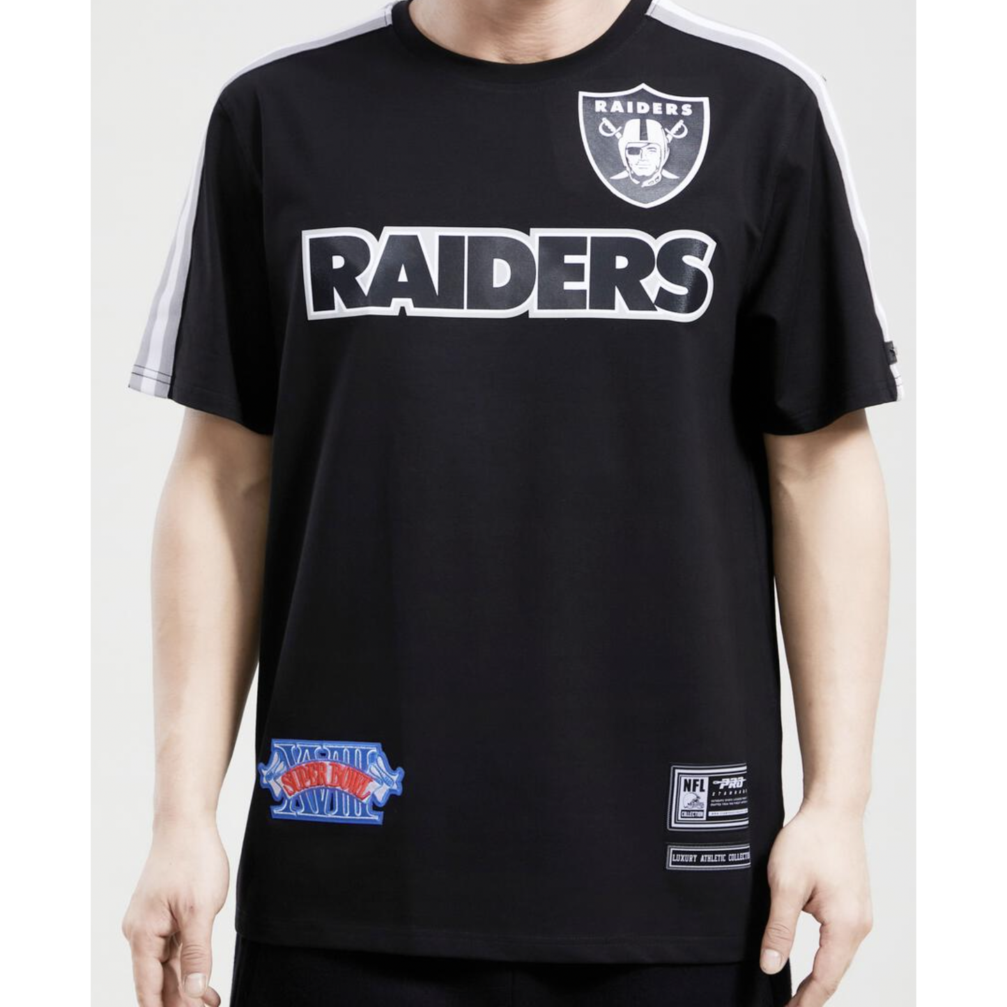 Black Las Vegas Raiders logo tee featuring pro team taping design