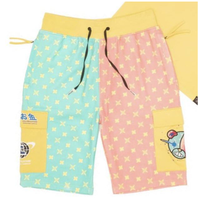 A pair of bright yellow shorts with a graphic of a bear head, perfect for a civilized and stylish outdoor adventure outfit