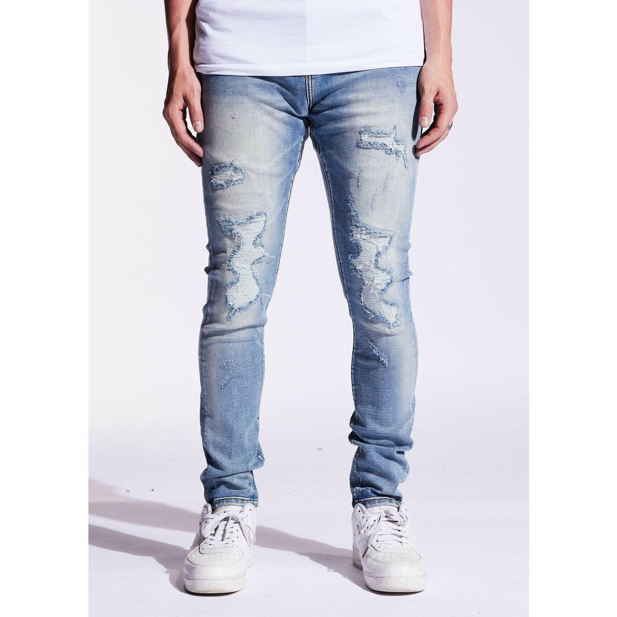 Close-up image of Crysp Denim Atlantic Blue Denim (CRYSPF221-106) showcasing its distressed texture and classic blue color, perfect for casual and trendy outfit ensembles