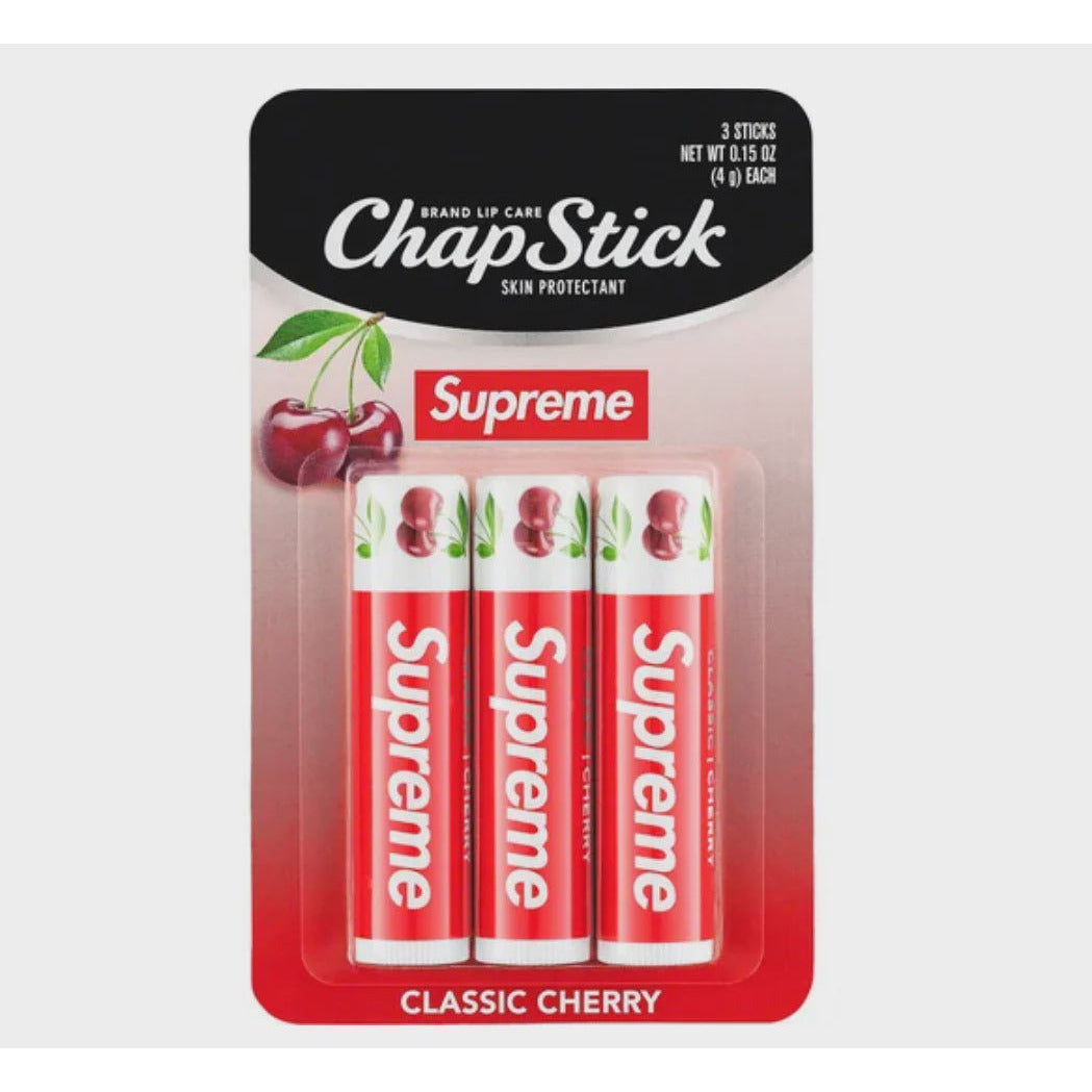 A pack of 3 Supreme Chapsticks, including cherry, mint, and vanilla flavors