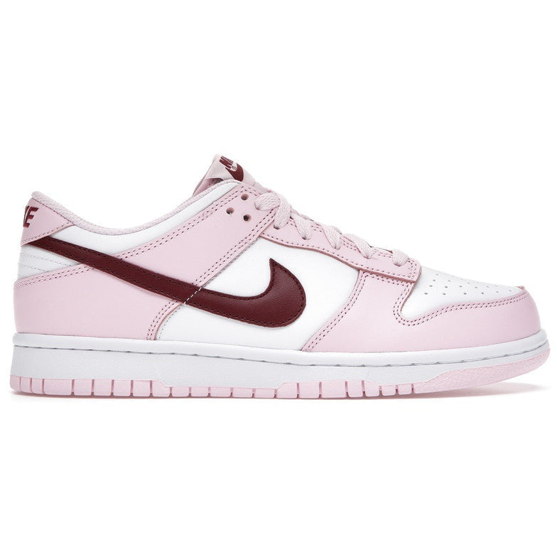 A pair of Nike Dunk Low Pink Foam Red White sneakers for kids, featuring a stylish and vibrant design perfect for active and fashionable youngsters